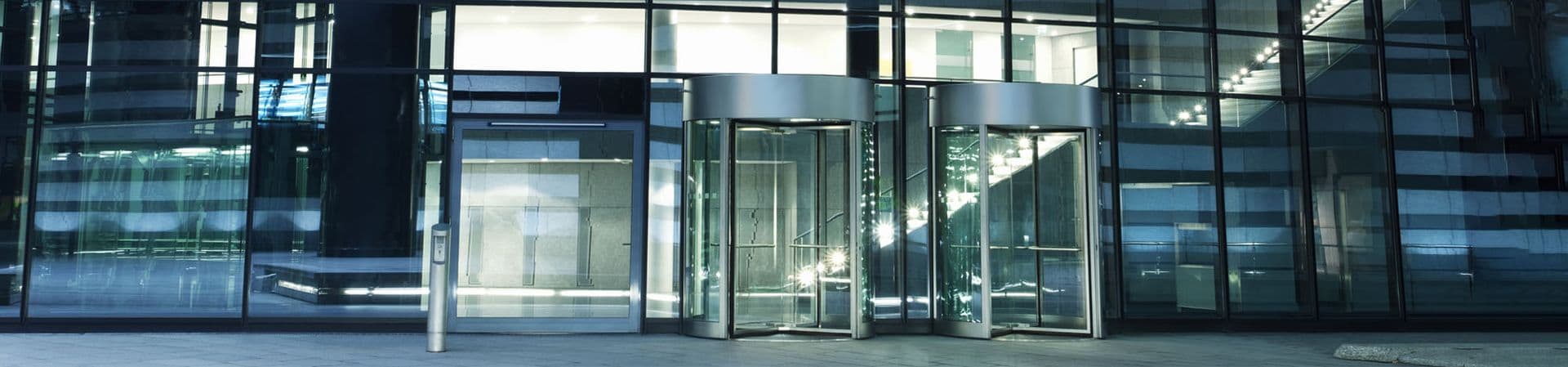 revolving doors in a glass building